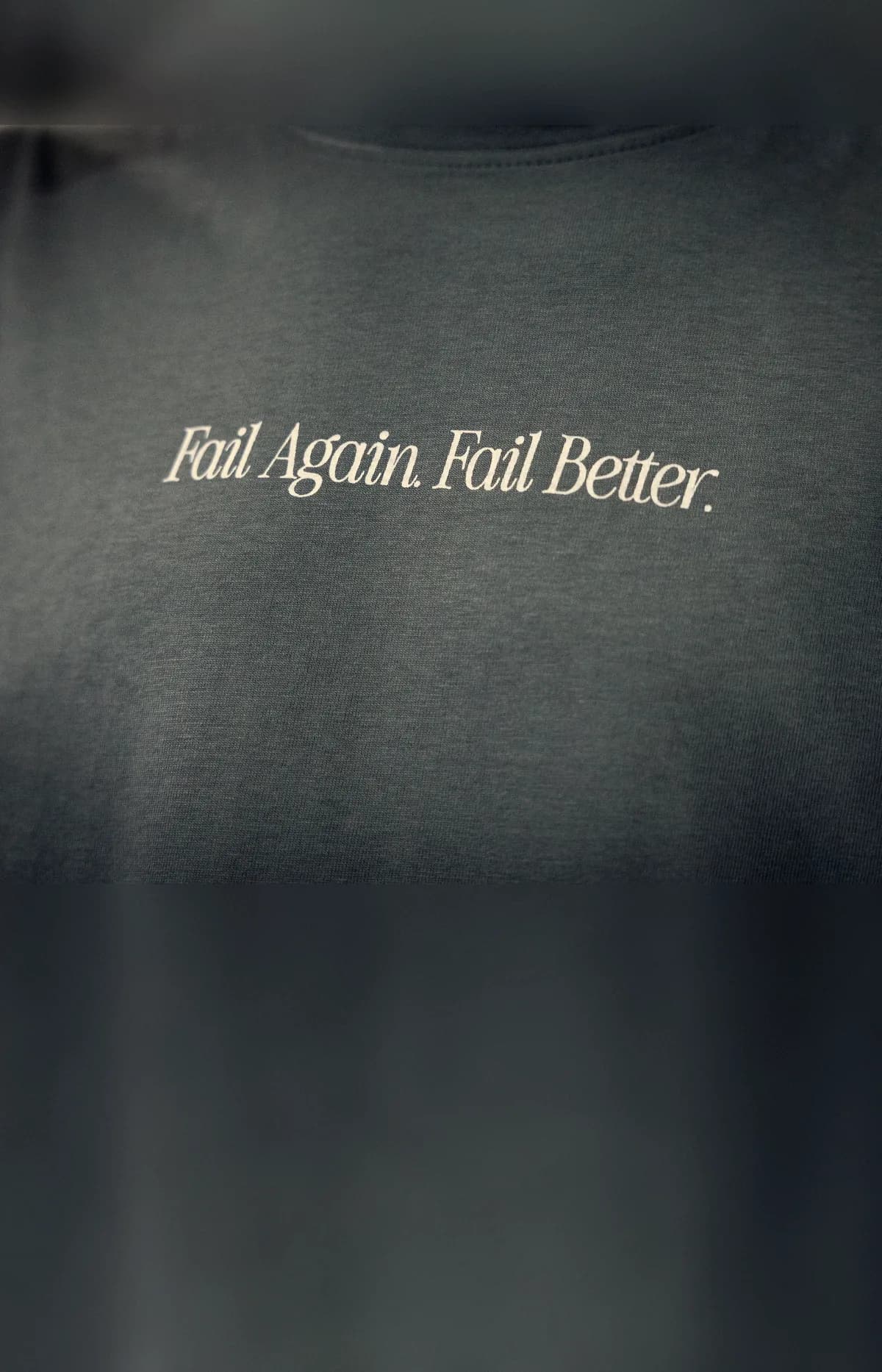 Close-up of the Fail Again. Fail Better. shirt